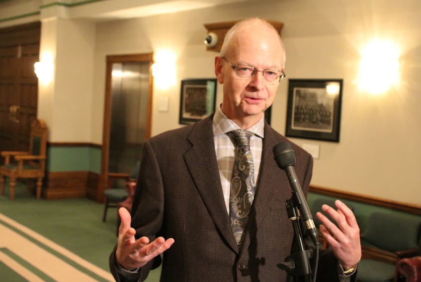 Progressive Conservative Leader Ches Crosbie speaks to reports Thursday outside the House of Assembly.