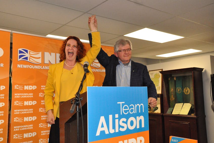 New NDP leader Alison Coffin, who won her seat in St. John’s East-Quidi Vidi district, and St. John’s Centre district winner Jim Dinn raise their arms in victory at the NDP headquarters at the BIS building on Harvey Road following election results Thursday night.