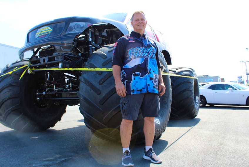 Jimmy Cretan, driver of Bounty Hunter, is here to participate in NAPA Auto Parts World Series of Monster Trucks at Eastbound International Raceway in Avondale July 19-21. He is shown with one of his trucks at Hickman Automotive Group's Chevy dealership on Kenmount Road on Thursday afternoon.