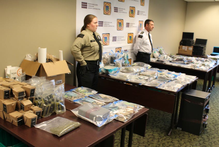 NLC enforcement officers laid out three tables’ worth of cannabis contraband, from flower to pre-rolled joints, to concentrates, at a Friday news conference. An undisclosed amount of cash and other paraphernalia was seized in the raid in St. John’s on Thursday evening.
