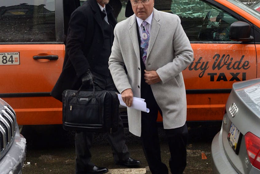 Galway developer and former premier Danny Williams (right) and his lawyer, Jerome Kennedy, arrive at Newfoundland and Labrador Supreme Court on Duckworth Street in St. John’s on Tuesday for their court case against the City of St. John’s.