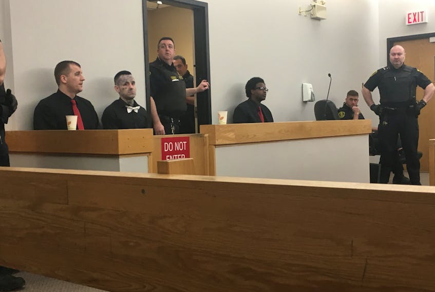 From left, Gary Hennessy, Mitchell Nippard and Abdifatah Mohamed in court in St. John’s on Tuesday morning.