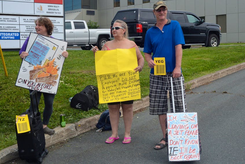This trio was among a handful of people who showed up Friday morning outside the Public Utilities Board (PUB) building on Torbay Road to voice their concerns over proposed electricity rate hikes as PUB hearings were taking place inside.