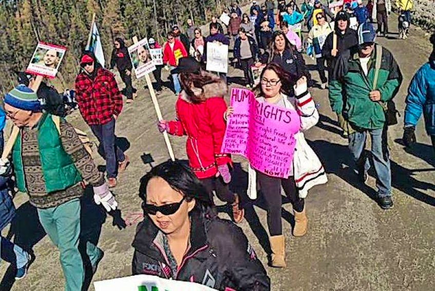 Protesters walk onto the Muskrat Falls worksite in Labrador in October 2016.