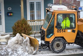 A City of St. John’s snowclearing crew member clears and salts a section of sidewalk on Empire Avenue in the Rabbittown area on Wednesday morning.