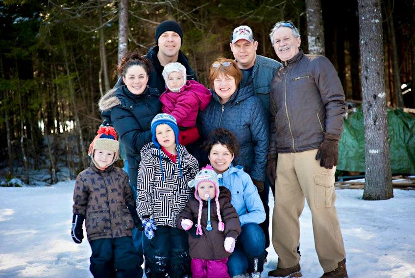 Jennifer Strowbridge and her family have seen some life-altering and heartbreaking changes the last four years, but they’re determined to make the children a priority. Pictured in a family photo taken in February 2012, are (from left, back row) Norm Farthing (who died May 14 of this year), Dane Sharron, Jennifer’s father Kevin Strowbridge; (middle row) Heather Farthing (who died June 15, 2014), Lauren Farthing, Jennifer’s mother Margaret Farthing; (front row) Jacob Sharron, Ethan Farthing, Jennifer Strowbridge and Amelia Sharron.