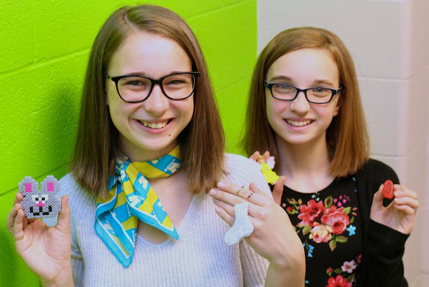 Rachel, 14, (left) and Julianne Moss, 11, display some of the items they sell in aid of the Janeway. The sisters will appear on this year’s Janeway Telethon on NTV Sunday afternoon, marking their 10th year of donating to the children’s hospital, for a total of more than $40,000.