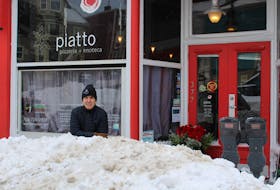 Brian Vallis, owner of the two Piatto restaurants in St. John’s, stands behind a huge snowbank in front of his Duckworth Street location. Vallis, like so many business owners downtown, knows lack of parking and heavy snow piled up detracts from customer traffic.