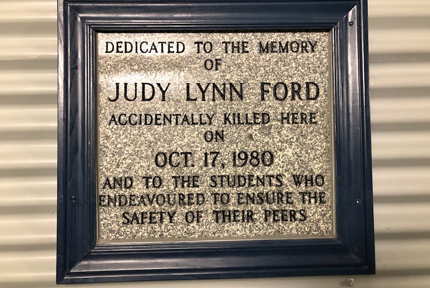 A plaque in memory of Judy Lynn Ford located in pedway connecting the University Centre with chemistry-physics building at Memorial University’s St. John’s campus.