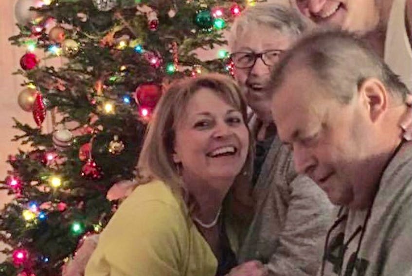 Reg Thorne is surrounded by his family — his mother Lily and sisters Emily and Cynthia — for Christmas, four months after he received a heart transplant in Ottawa.
