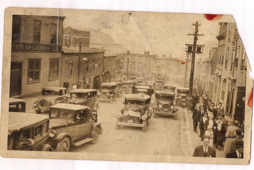 A traffic jam in St. John’s nearly 90 years ago. This photograph, likely from the early 1930s shows cars coming up King's Road. Some of them bear flags so it has been suggested that the vehicles and well-dressed pedestrians may be coming up from a ceremony at the war memorial. A corner of the new Bishop Feild College can be seen upper left.
