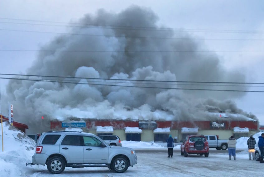 The Reitmans Building in Happy Valley-Goose Bay was burning as of deadline Sunday. The building houses several businesses.