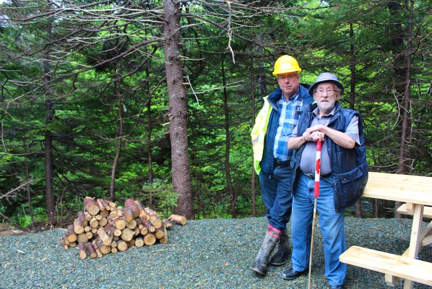 Dan Walker (left) and his father, Lloyd Walker, on family land that is being developed into the Waterford River Valley Campground in Mount Pearl.