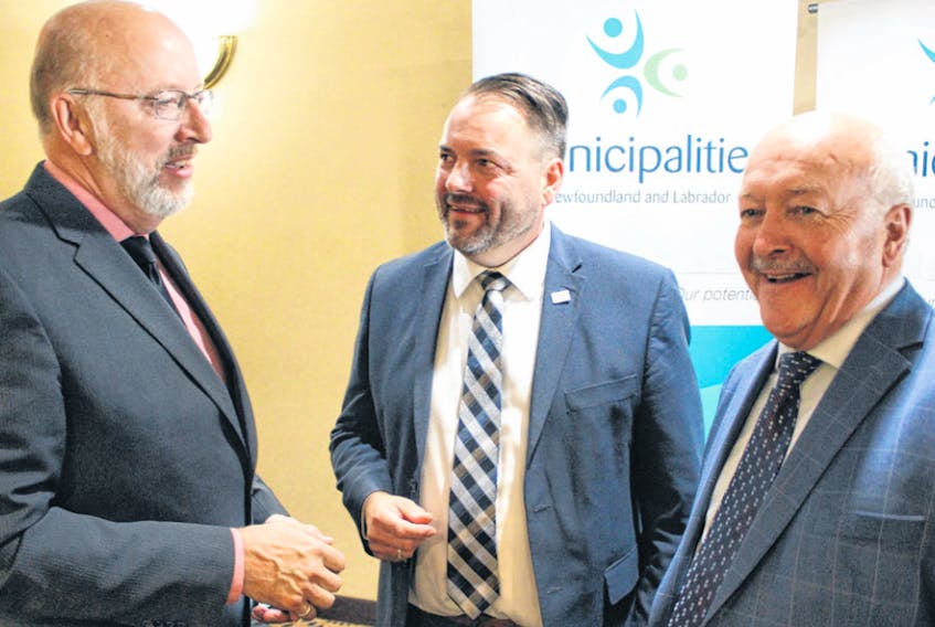 From left, newly minted Municipal Affairs and Environment Minister Perry Trimper, Municipalities Newfoundland and Labrador president Tony Keats and MP Churence Rogers deliver their assessment of Friday’s meeting to reporters.
