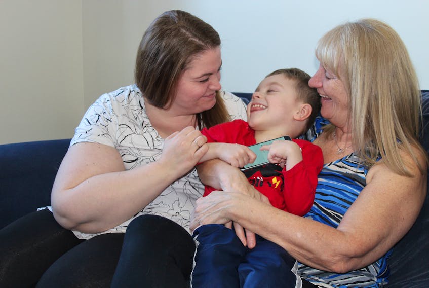 Tracy Gale (left) laughs with her son, Henry, 4, and her mother, Joselyn Banke. The trio, with the help of family and friends, have launched a pair of fundraising ventures to get Henry to a clinic in New Jersey where he can obtain selective percutaneous myofascial lengthening, a procedure that will cost more than US$17,000.