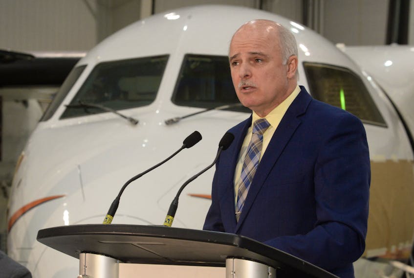 Finance minister Tom Osborne speaks about the findings of the McKinsey and Company report Monday at the PAL Aerospace hangar at St. John’s International Airport.