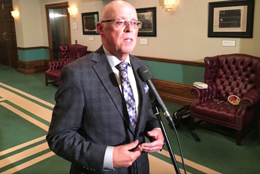 Health Minister John Haggie speaks to reporters Wednesday at the Confederation Building about a recent poll that shows 19 per cent of people in this province don't have a family doctor.
