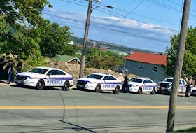A group of RNC officers, with their police vehicles parked in a line, were at the scene of a suspected stabbing at 374 Empire Ave. Friday afternoon. One man was taken to hospital and another was taken into custody.
