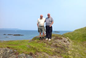 Ray Hann (left) grew up in Merasheen before his family was resettled in 1968. He and his wife now spend their summers there. He is pictured at Merasheen with friend Sam Fulford.