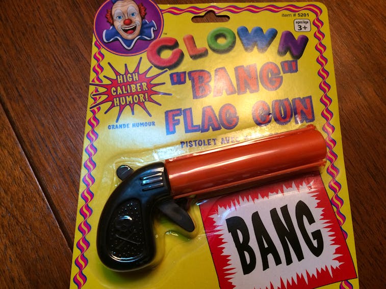 A “BANG Flag Gun,” complete with warnings not to point it at anyone because “This product may be mistaken for an actual firearm by law enforcement officers and others.”