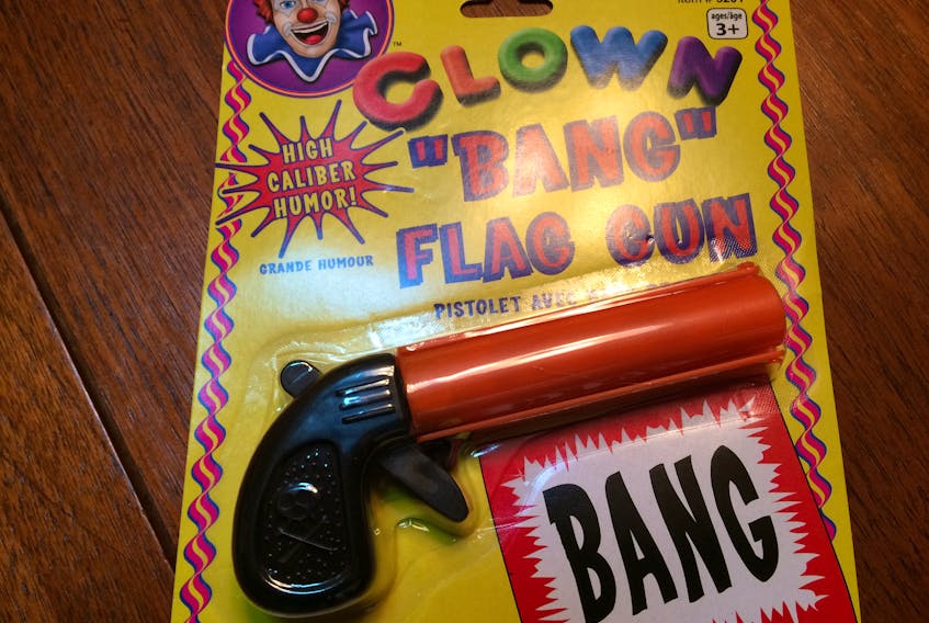 A “BANG Flag Gun,” complete with warnings not to point it at anyone because “This product may be mistaken for an actual firearm by law enforcement officers and others.”