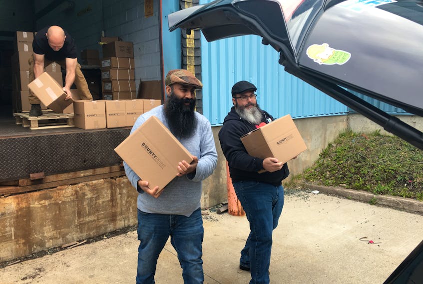 Newfoundland and Labrador Beard and Mustache Club president Hassan Hai (left) and vice-president Jeff Hillyard stopped by The Telegram and Bounty Print offices in St. John’s on Friday morning to pick up their freshly printed Merb’ys 2019 calendars.