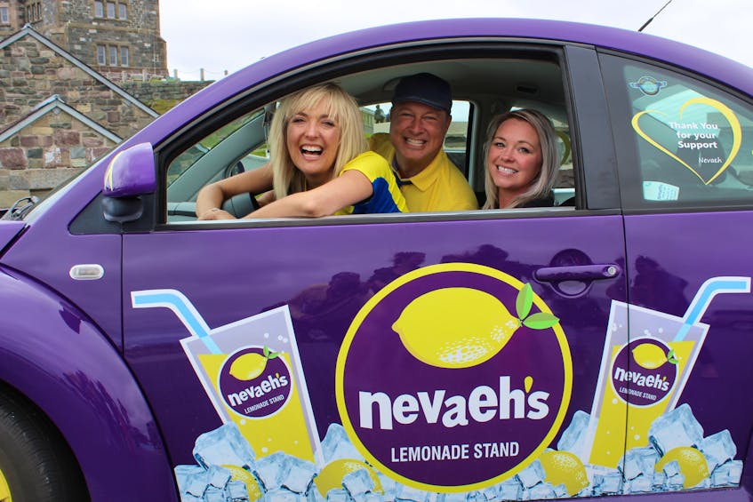 What better way to help celebrate a life than to commemorate it in song. Splash’N’Boots (Taes Leavitt and Nick Adams) joined Nevaeh Denine’s mother Holly in her Lemonademobile Monday in front of Cabot Tower, just days away from what would have been Nevaeh’s 10th birthday on July 27. The duo, who performed in St. John’s this past weekend, were shooting footage to be used for their next single “Lemonade” from their Juno-award winning album “You, Me and the Sea,” recorded here and co-written with Newfoundland singer/songwriter Alan Doyle.
