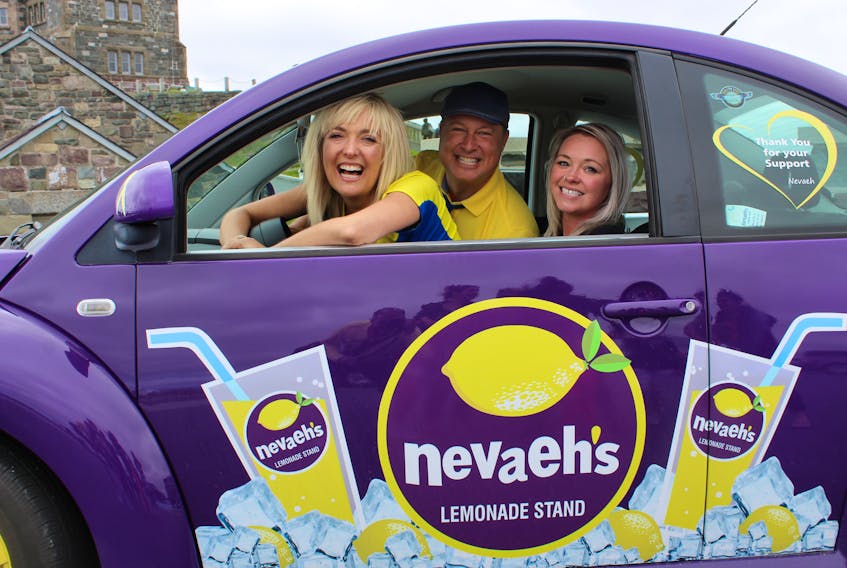 What better way to help celebrate a life than to commemorate it in song. Splash’N’Boots (Taes Leavitt and Nick Adams) joined Nevaeh Denine’s mother Holly in her Lemonademobile Monday in front of Cabot Tower, just days away from what would have been Nevaeh’s 10th birthday on July 27. The duo, who performed in St. John’s this past weekend, were shooting footage to be used for their next single “Lemonade” from their Juno-award winning album “You, Me and the Sea,” recorded here and co-written with Newfoundland singer/songwriter Alan Doyle.