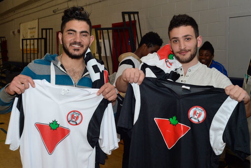 Co-captains Mohamed Alsharif (left) and Ibrahim Aless of the Telegram/Canadian Tire United Football Club proudly display the jerseys the club will wear during its inaugural season in the St. John’s Soccer League intermediate men’s division. The team, comprised primarily of new Canadians, is a celebration of the trials and tribulations the group of young men have gone through to get to this point in their lives and field a team. — Joe Gibbons/The Telegram
