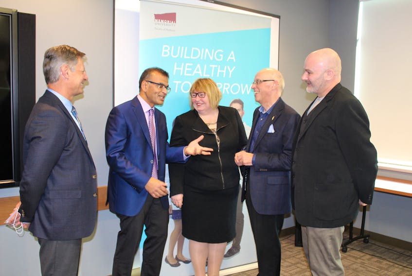 Chris Halyk, Janssen Inc.’s president (far left), was on hand Wednesday morning to announce a partnership between Janssen Inc. and the Newfoundland and Labrador Health Innovation Partnership (JANL-HIP). Chatting about the project following the announcement are (from left) Halyk, rheumatologist Dr. Proton Rahman, Memorial University faculty of medicine dean Dr. Margaret Steele, Health Minister John Haggie and psoriatic arthritis sufferer Steven Duffy.