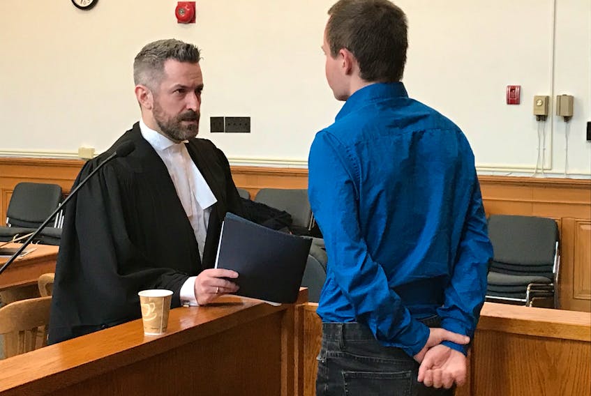 Max Vivian speaks with his lawyer, Mike King, during a break in his sexual assault trial at Newfoundland and Labrador Supreme Court in St. John’s Thursday afternoon. Vivian is expected to testify Friday.