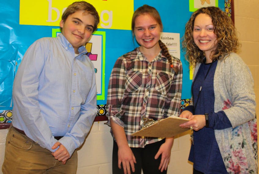 Students at Macdonald Drive Junior High in St. John’s will get a lesson in an anti-cyberbullying message on Thursday as part of the WE Rise Above campaign the school is part of. Final preparations in the initiative are nearly complete, including this quick meeting of (from left) student council president Daniel Blackmore, leadership committee member Silvi Ivardi and guidance counsellor Christina Watton, staff adviser to the WE programs. The group discusses what will occur from 1:30-5:30 p.m. on Thursday.