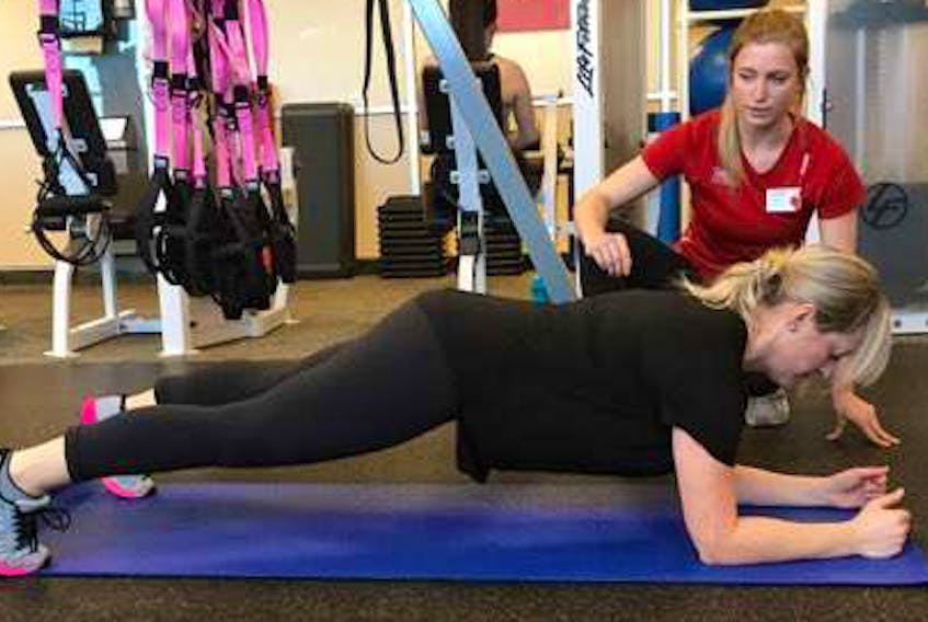 Ensuring you maintain a flat back is crucial while completing the plank portion of your workout in the gym or at home. Lorna Coady, a teacher at Leary’s Brook Junior High School, has been working with personal trainer Krista Hogan of GoodLife Fitness on Blackmarsh Road in St. John’s for the past year and has seen her fitness level increase and her stress level decline from the work she has put in.