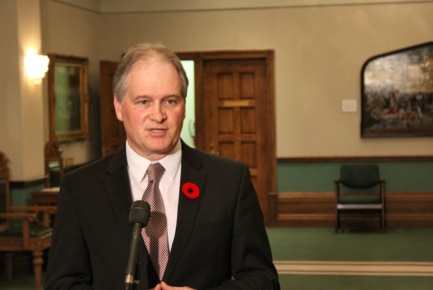Opposition House Leader Keith Hutchings speaks to reporters Wednesday.