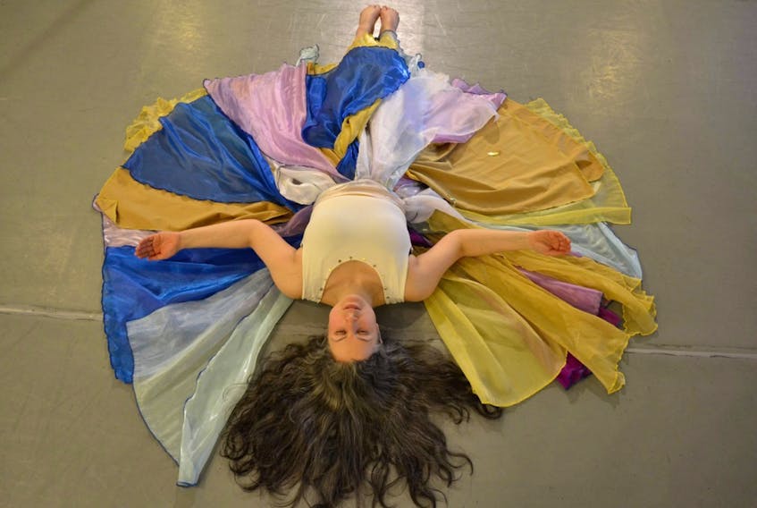 Performance artist Corie Harnett rehearses for “Ori,” her collaborative show with textile artist Bruno Vinhas, running this week at the Barbara Barrett Theatre in St. John’s.