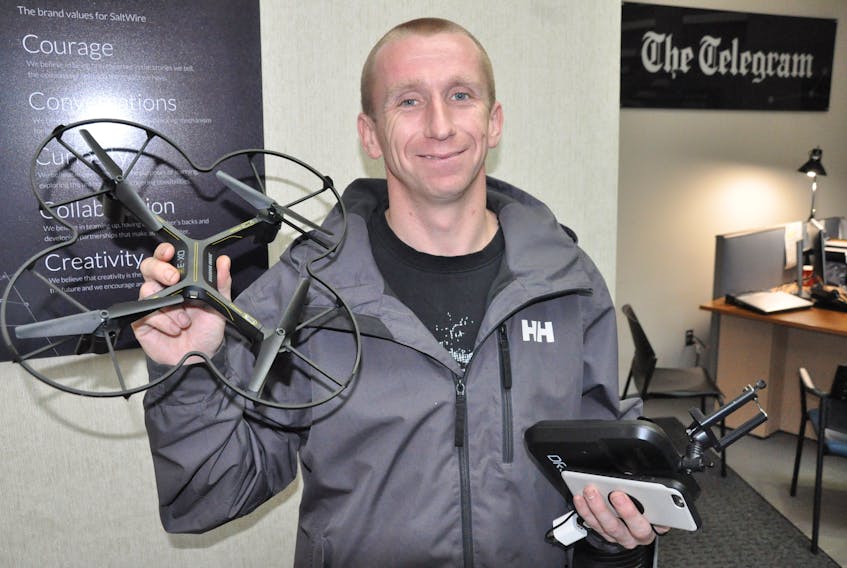Dominic Cole holds the drone he thought had been lost for good when high winds took hold of it last week in the city’s east end. The drone made a safe landing between two cars on The Telegram’s parking lot.