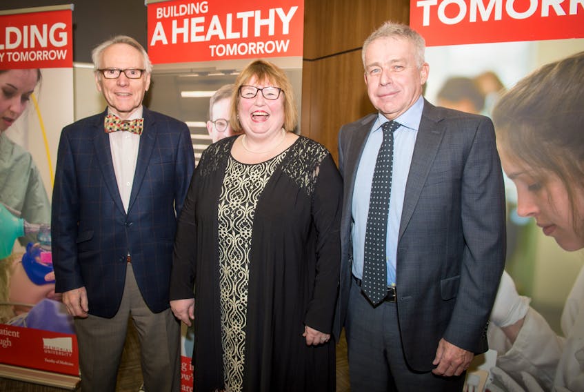 John O’Dea (left), Dr. Peter Collingwood (right) and Dr. Margaret Steele, dean of the faculty of medicine.