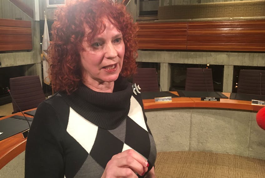 Coun. Debbie Hanlon speaks to reporters Monday at St. John’s City Hall.