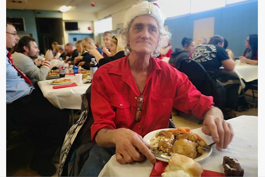 Monday was John Hines' first time attending the annual Rogers Rogers Moyse Christmas community dinner, at the Knights of Columbus on St. Clare Avenue, but he was curious to see who he knew and excited to see how the food was.