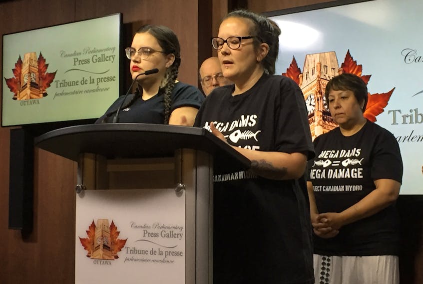 Amy Norman and Erin Saunders, Inuit land and water protectors from Happy Valley Goose Bay, address the media in Ottawa in West Block Monday. They were in the capital Monday to present a petition with 15,000 signatures calling on Environment Minister Catherine McKenna to take immediate measures to stop methylmercury poisoning due to the Muskrat Falls hydroelectric project.