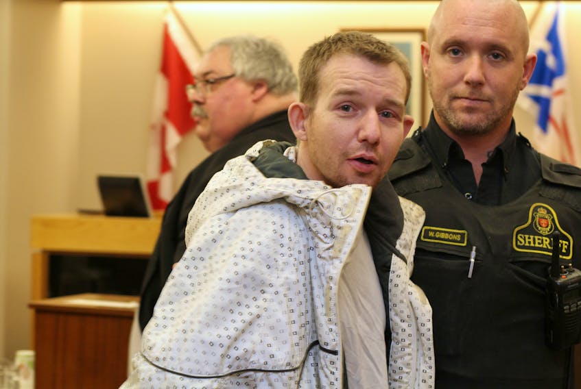 Ryan Farrell, 31, prepares to leave the courtroom during a lunch break in his trial Wednesday. Later in the day, Farrell was acquitted of all charges in connection with a stabbing on Southside Road in St. John’s in March.
