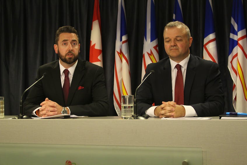 Justice Minister Andrew Parsons and deputy minister Todd Stanley speak to the media Monday at Confederation Building, as the government begins an emergency session of the House of Assembly to pass amendments to the Newfoundland and Labrador Elections Act.