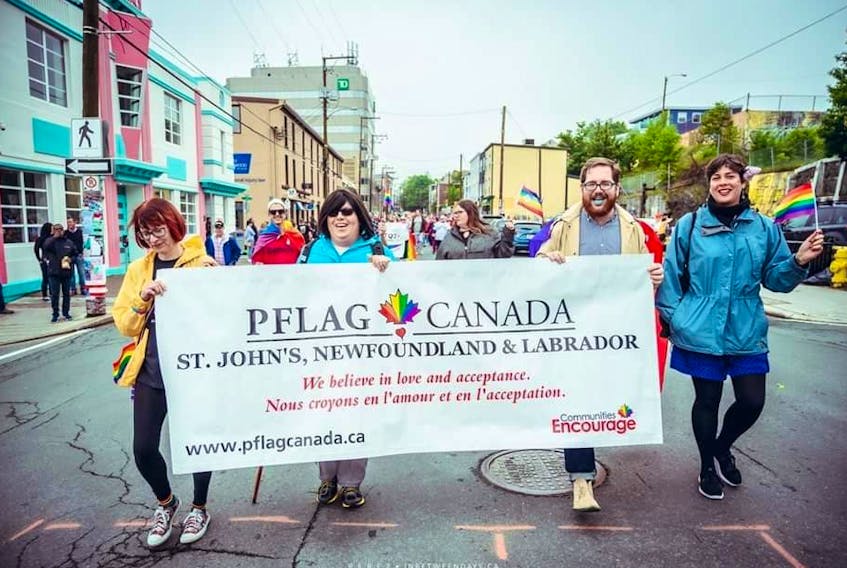 Some members of PFLAG St. John's march in Sunday's Pride Parade.