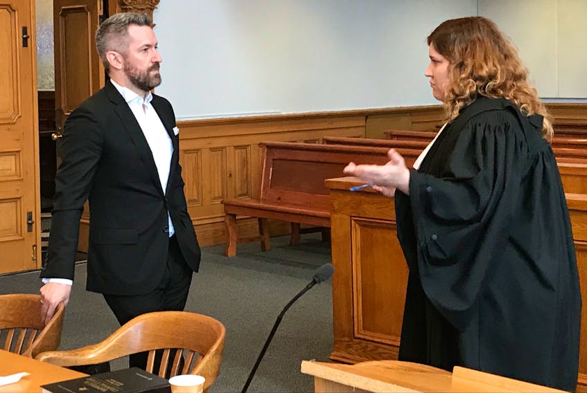 Defence lawyer Mike King and Crown prosecutor Alana Dwyer chat once Max Vivian's court case is adjourned in Newfoundland and Labrador Supreme Court in St. John's Wednesday afternoon.