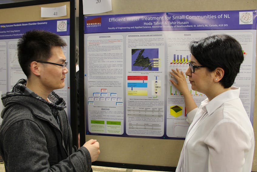 Hoda Tafvizi, an Iranian PhD engineering student, explains her water research to Fugiang Tan during the 3rd annual Research Day activities at Memorial University in St. John’s Wednesday.