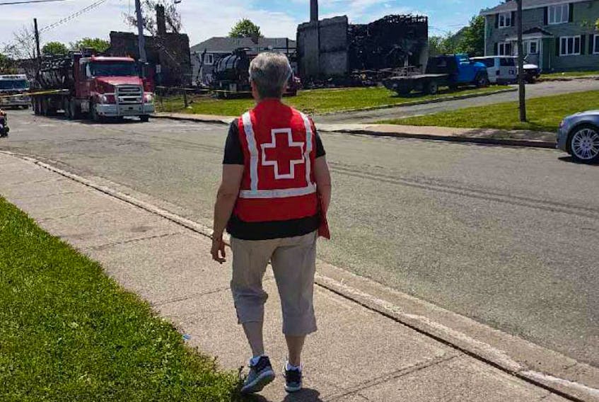 Canadian Red Cross volunteer Anne Tremblett works the front lines at the Froude Avenue fire.
