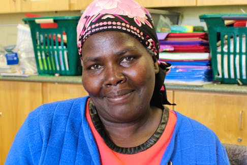 Teresa Nabukobwa, immigrant from Burundi, sews baskets from grasses and recycled plastic bags.