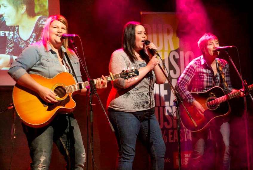 The Secrets on stage (from left) Karla Pilgrim, Terry Lynn Eddy and Renée Batten, are an acclaimed country music group, but over the next month, will be performing a pair of gospel shows.