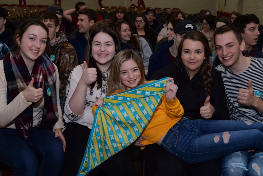 Hilary Warren proudly displays her Janeway Telethon bandanna supported by Grade 12 students (from left) Emma Jacobs, Samantha Bursey, Rachel Greenslade and Matthew Broders.