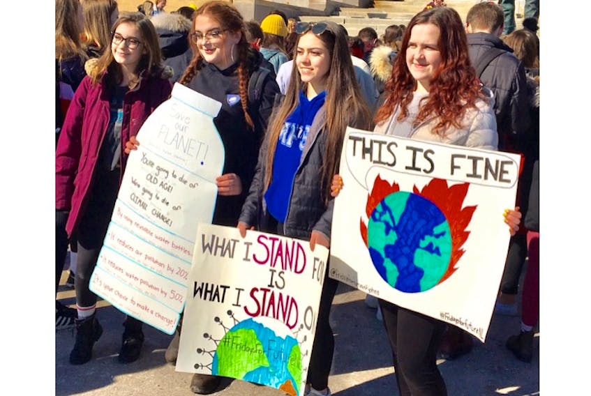 Mount Pearl Senior High students (from left) Hunter Fleming, Ireland Power Halleran, Katie Ash and Mackenzie Oates joined a protest at Confederation Building in St. John’s Friday to express their concern about the climate change crisis.